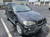 Black BMW X5 SUV front three-quarter view