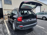 Black SUV with open hatch displaying cargo area